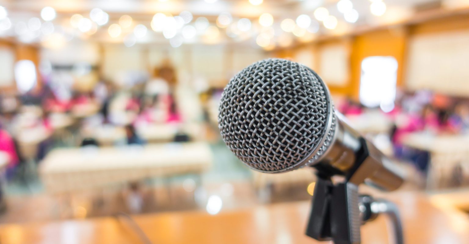 Black microphone in conference room